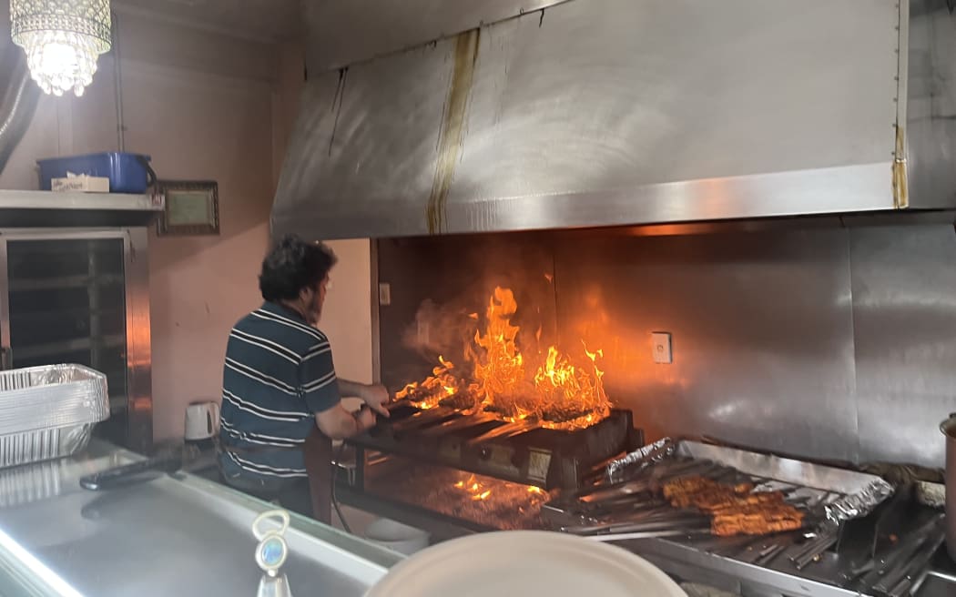 Afghan owner Abdul gets the grill ablaze.