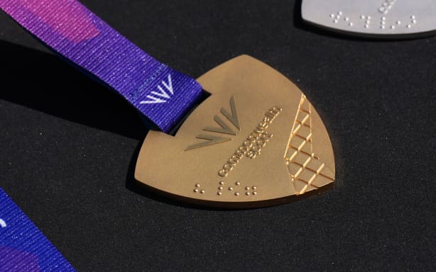 Braille on a Commonwealth Games medal during a visit by Prince William, Prince of Wales to the Ysgol Gymraeg Llundain (The London Welsh School)on July 7,2026 in London, England. He joined pupils in sending their best wishes to Team Wales ahead of the Glasgow 2026 Commonwealth Games, taking place from July 23 to August 2, featuring 10 sports and six para-sports. (Photo by Aaron Chown - WPA Pool/Getty Images) (Photo by Aaron Chown - WPA Pool/Getty Images)