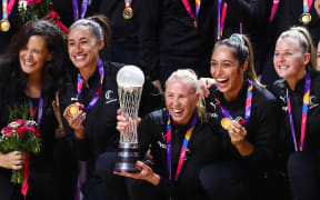 Laura Langman holding the World Championship trophy.