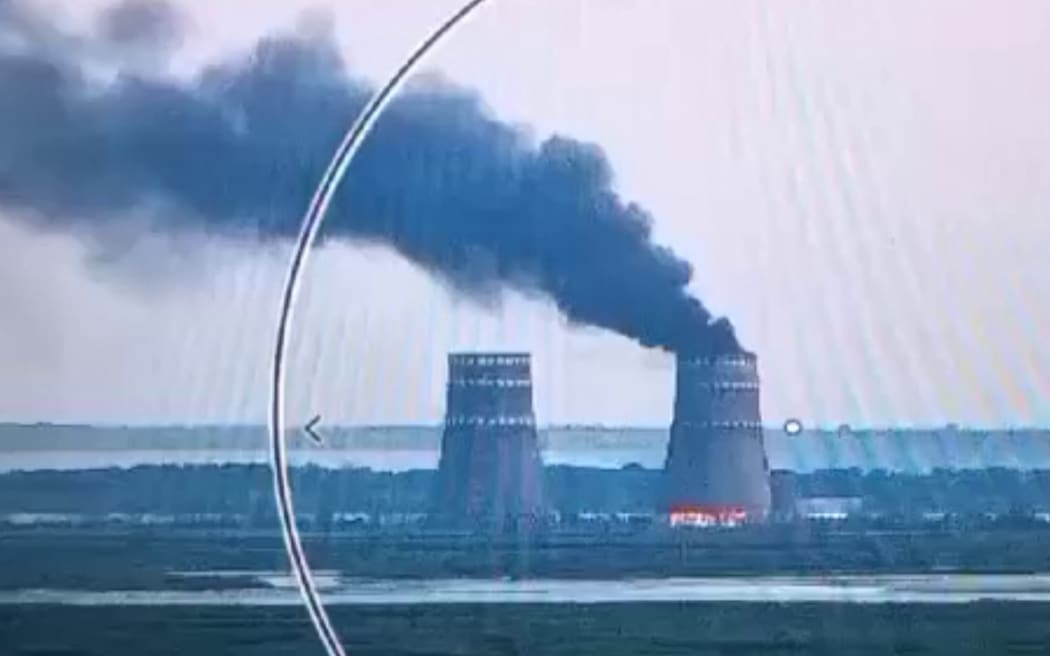 This video grab taken from a handout footage released by the Ukrainian Presidential Press Service on August 11, 2024, shows a fire at a cooling tower of the Russian-controlled Zaporizhzhia nuclear power plant in Energodar, Southern Ukraine. (Photo by Handout / UKRAINIAN PRESIDENTIAL PRESS SERVICE / AFP) / RESTRICTED TO EDITORIAL USE - MANDATORY CREDIT "AFP PHOTO / UKRAINIAN PRESIDENTIAL PRESS SERVICE" - NO MARKETING NO ADVERTISING CAMPAIGNS - DISTRIBUTED AS A SERVICE TO CLIENTS