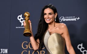 US actress Demi Moore poses with the Best Performance by a Female Actor in a Motion Picture – Musical or Comedy award for "The Substance" in the press room during the 82nd annual Golden Globe Awards at the Beverly Hilton hotel in Beverly Hills, California, on January 5, 2025.