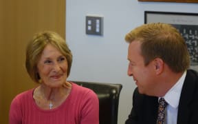 Kristine Bartlett, who took the initial case in the Employment Court, signs the deal with Health Minister Jonathan Coleman.