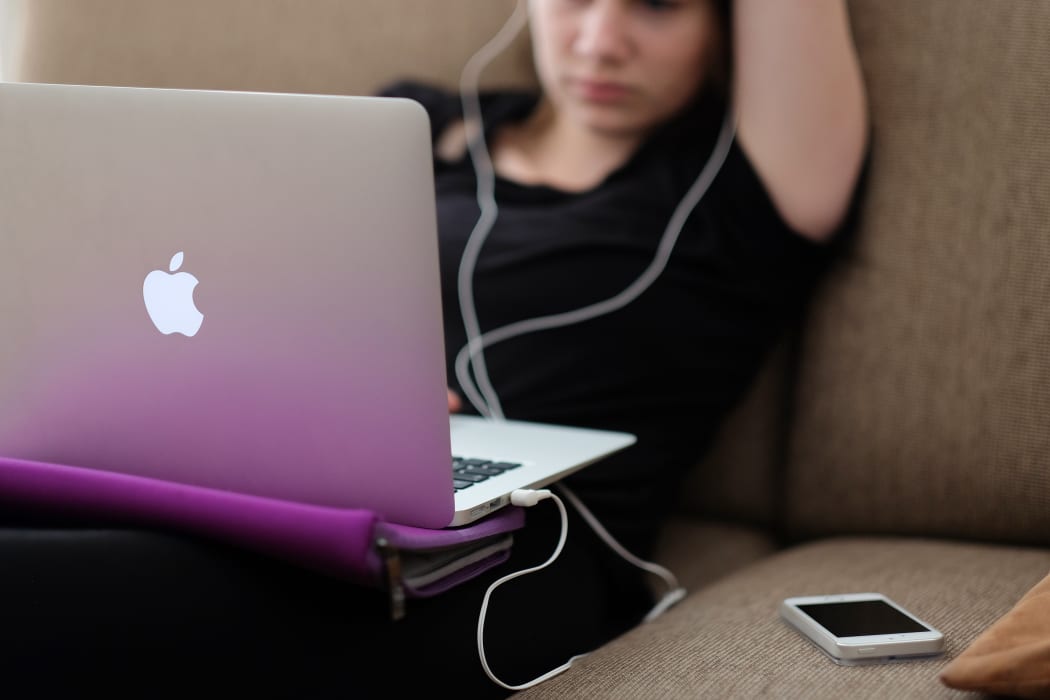 teenage girl on laptop