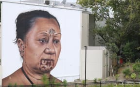 Taa moko artist Tania Cotter depicted in Owen Dippie's mural 'Hine' (Auckland)