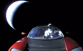 3290409 02/08/2018 SpaceX CEO Elon Musk's own car, red Tesla Roadster cabrio, entered into orbit by the Falcon Heavy launcher, with a dummy wearing a spacesuit at the steering wheel, in outer space.
