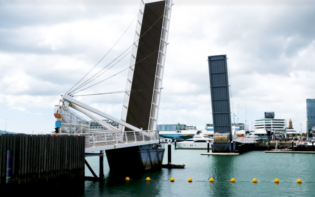 A pedestrian bridge linking the Auckland Viaduct to a strip of waterfront restaurants is broken and stuck in its upper position.