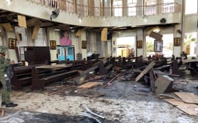Armed Forces of the Philippines photo taken on January 27, 2019, shows debris inside a Catholic Church where two bombs exploded in Jolo, Sulu province on the southern island of Mindanao.