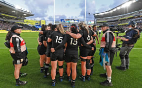 The Black Ferns team huddles during their one-point semi-final win over France at the Rugby World Cup.