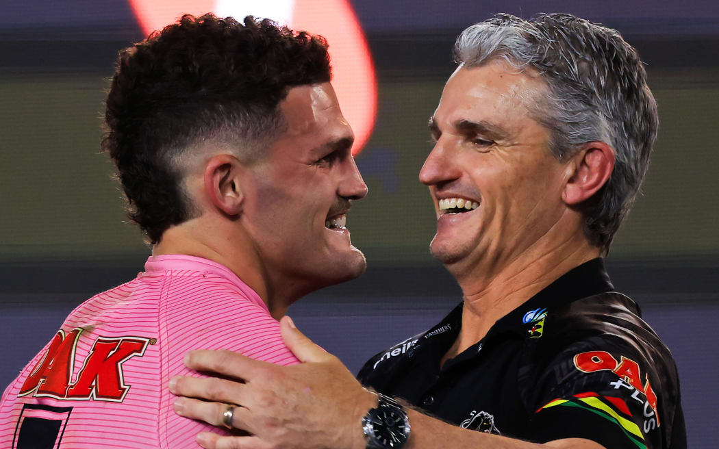 Nathan Cleary of the Panthers and Panthers coach Ivan Cleary hug after victory during the NRL Grand Final match between the Melbourne Storm.