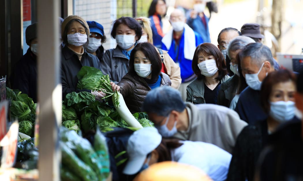 Shoppers shopping for food at a supermarket in Edogawa Ward, Tokyo on March 26, 2020, amid the Covid-19 outbreak.
