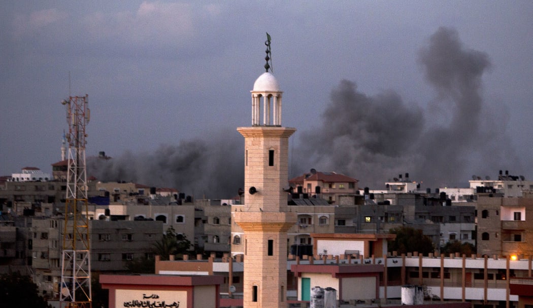 Smoke billows following an Israeli air strike in Gaza City.