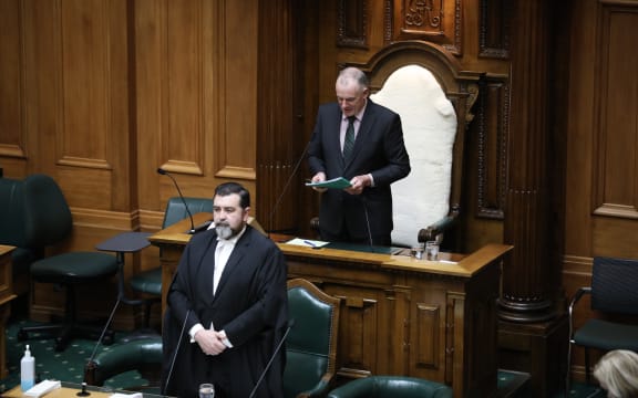 Speaker Trevor Mallard begins Parliament's day with a prayer as Clerk of the House David Wilson listens from The Table