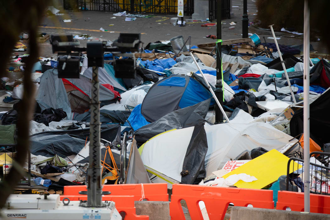 Tents and rubbish litter Parliament grounds after clashes between police and protesters yesterday.