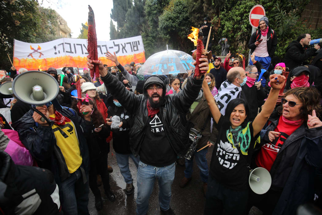 People gather to protest against Israeli Prime Minister Benjamin Netanyahu for his failure to combat the Covid-19 pandemic and his corruption charges cases and demanding his resignation
