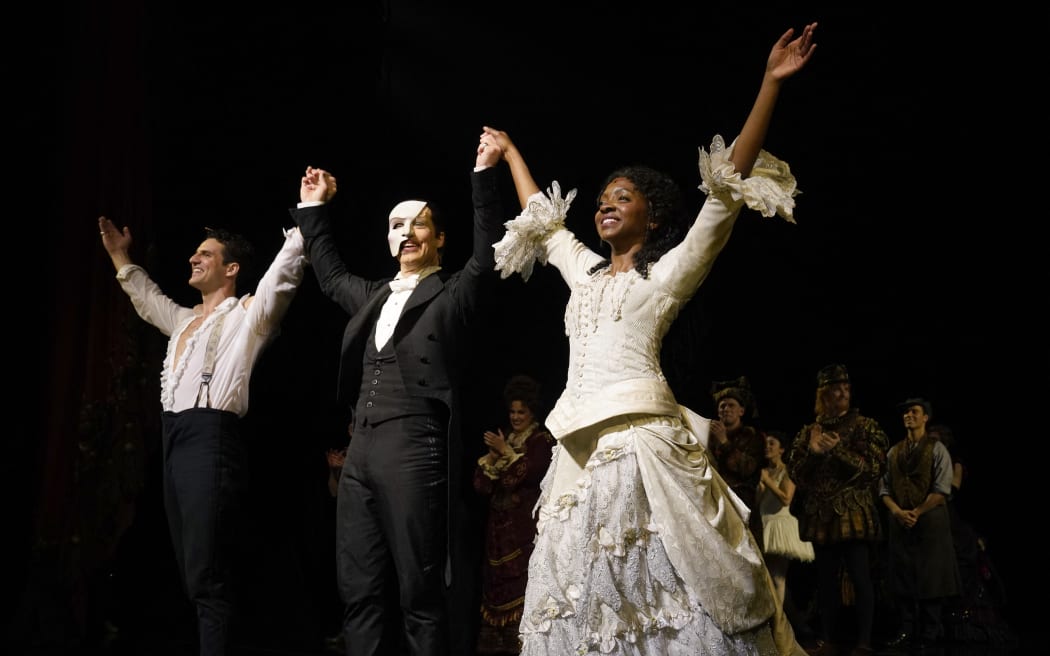 John Riddle as Raoul, Laird Mackintosh as the Phantom and Emilie Kouatchou as Christine, take a bow at the end of the final performance of The Phantom of the Opera.