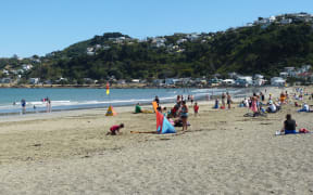 Crowds enjoy the hot weather at Wellington's Lyall Bay.