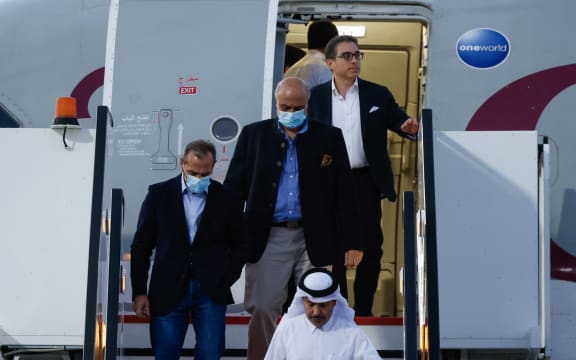 US citizens Siamak Namazim right, (at back), Emad Sharqi, left, and Morad Tahbaz, centre, disembark from a Qatari jet upon their arrival at the Doha International Airport in Doha on18  September, 2023.