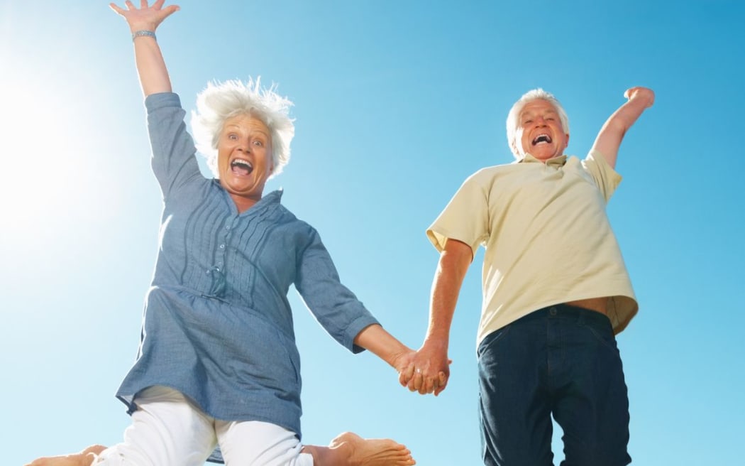 Senior couple jumping