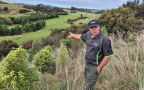 Jason Christensen overlooking recent plantings on the farm.