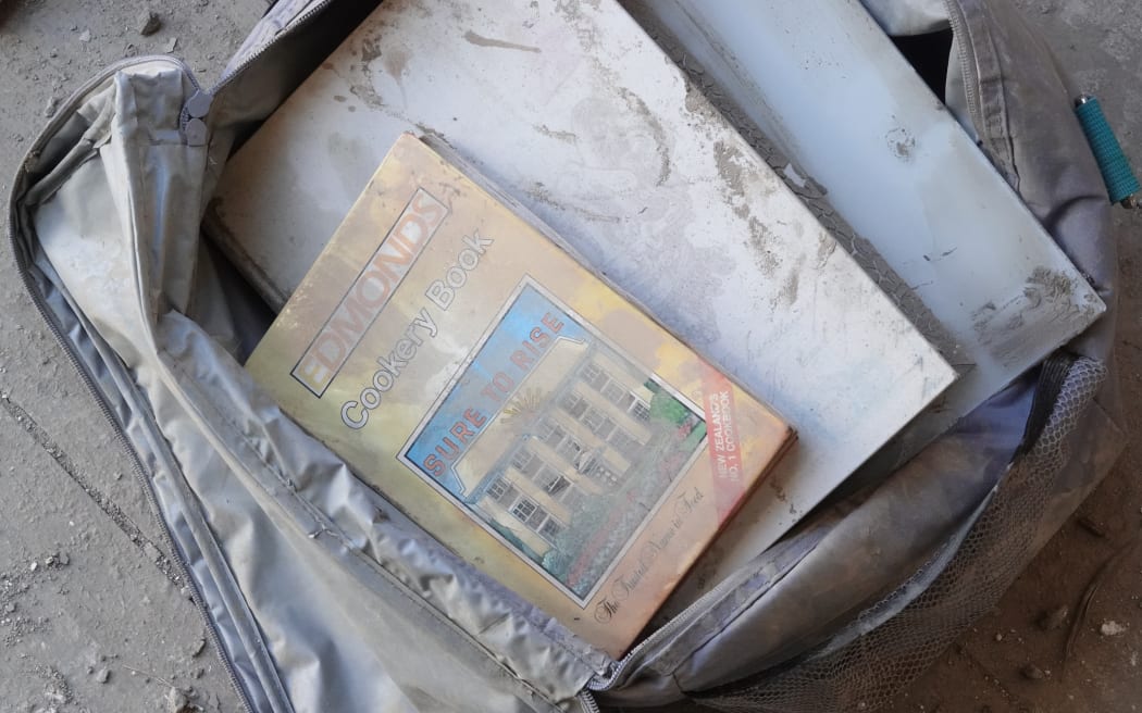 Many of Olly Midgley's possessions are covered in silt, post Cyclone Gabrielle.