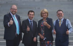 Waimakariri Mayor Dan Gordon (left), Local Government Minister Simeon Brown, Manawatu Mayor Helen Warboys and Whangārei Mayor Vince Cocurullo give their thumbs to the repeal of Three Waters legislation in February 2024.