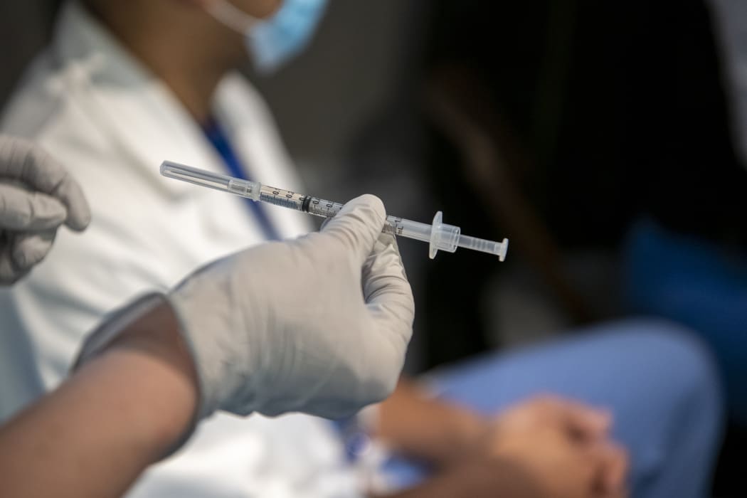 A syringe filled with Covid-19 vaccine ready to be administered. This week Mass General Hospital in the US administered the first of its Covid-19 vaccinations to employees.