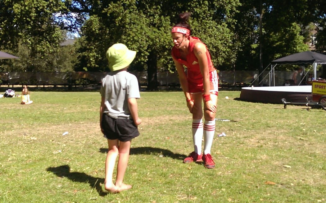 Sport Sally entertains a member of the public.