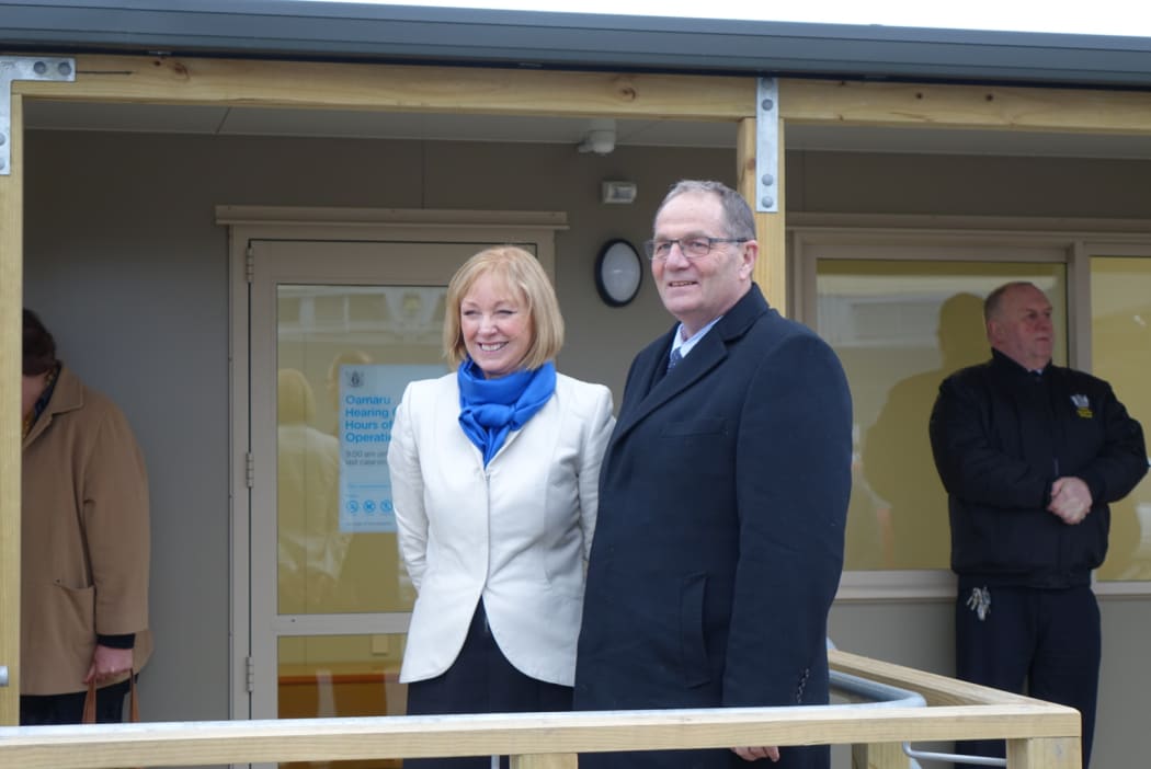 Courts minister Chester Borrows and Jacqui Dean at the opening of a prefab in an Oamaru carpark.