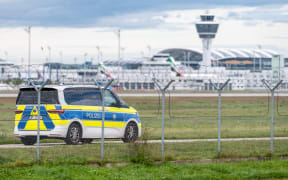 04 October 2025, Bavaria, Munich: A police vehicle drives on the grounds of Munich Airport. After sightings of drones, flight operations were resumed on Saturday morning. Photo: Armin Weigel/dpa (Photo by ARMIN WEIGEL / dpa Picture-Alliance via AFP)