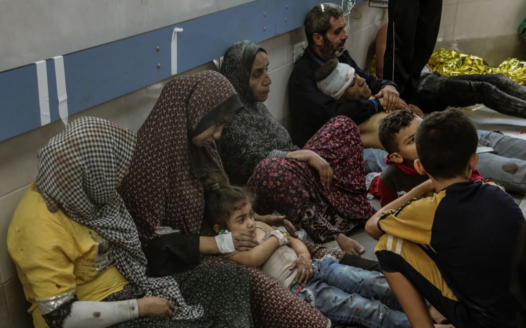 Injured people rest at a hospital in Gaza on 23 October, 2023.