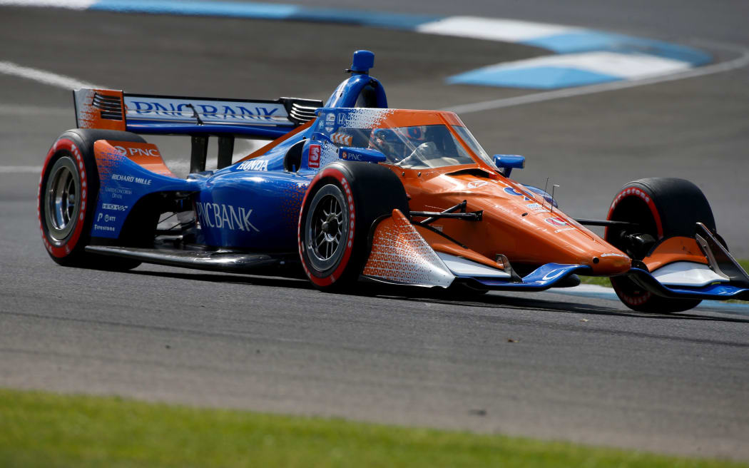 IndyCar driver Scott Dixon (9) drives through turn 2 during practice for the IndyCar Harvest GP Race 1 at the Indianapolis Motor Speedway in Indianapolis, Indiana.