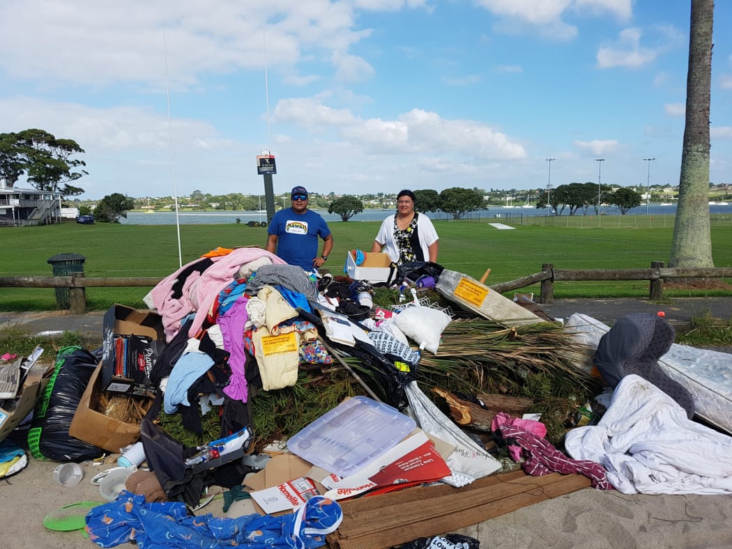 Andrew Va'a and Josephine Bartley behind the fly-tipped dump.