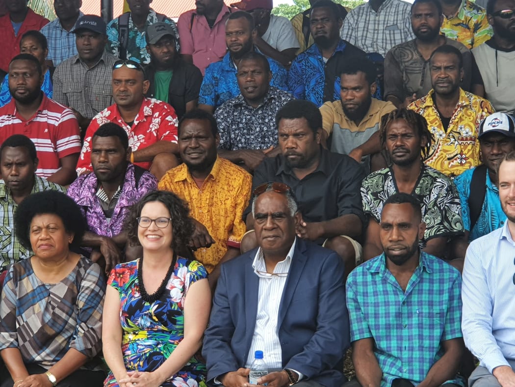Ishmael Kalsakau (front centre) and the Australian High Commissioner Sarah deZoeten (to his left) farewell workers