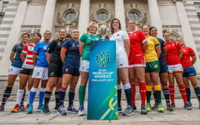 Team captain's pose with the World Cup trophy ahead of the women's Rugby World Cup.