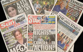An arrangement of UK daily newspapers photographed as an illustration, shows front page headlines reporting on the story of the interview given by Meghan, Duchess of Sussex, wife of Britain's Prince Harry, Duke of Sussex, to Oprah Winfrey, which aired on US broadcaster CBS.