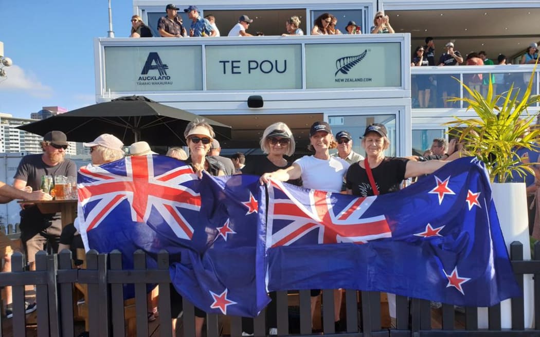 Sisters Noni Plunkett, Ainsley Harding, Gabriel Fergus, Helene Green stoked about Team NZ's win and are waiting for the team to come up the stage.