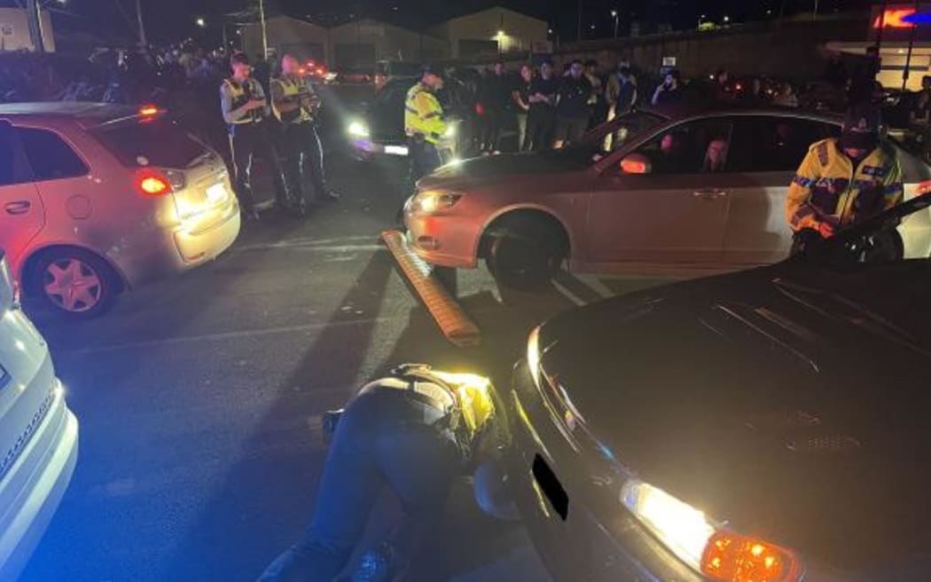 Police intercepting a boy-racer met of 100 vehicles at Kmart in Petone.