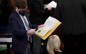 The certified electoral votes for the state of Arizona are shown prior to an objection by Rep. Paul Gosar during a Joint Session of Congress on January 06, 2021 in Washington, DC.
