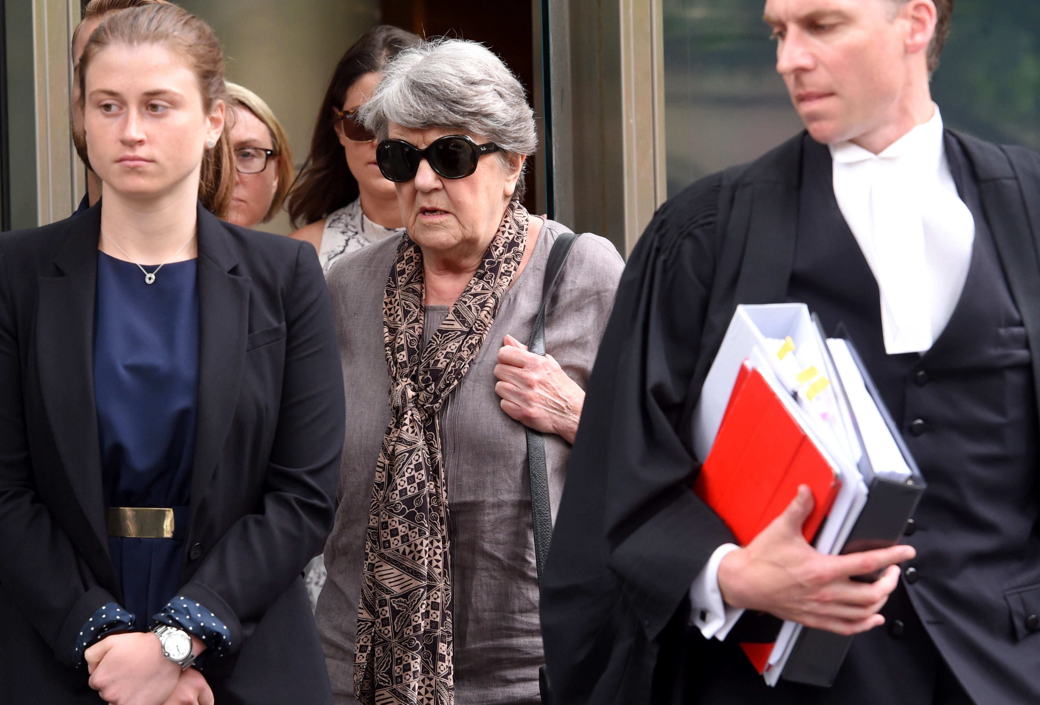 Maggie Kirkpatrick (centre) leaves the County Court in Melbourne, Monday, Dec. 7, 2015.