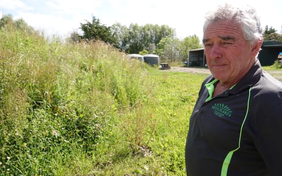 Mike Parker's property is covered in piles of silt.