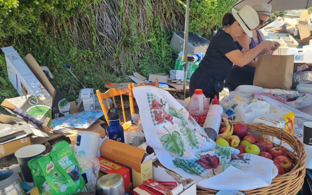 Houses on Joll Road in Havelock North were inundated with contaminated mud during Cyclone Gabrielle, but the community and Navy pitched in to help clean up the street and homes.