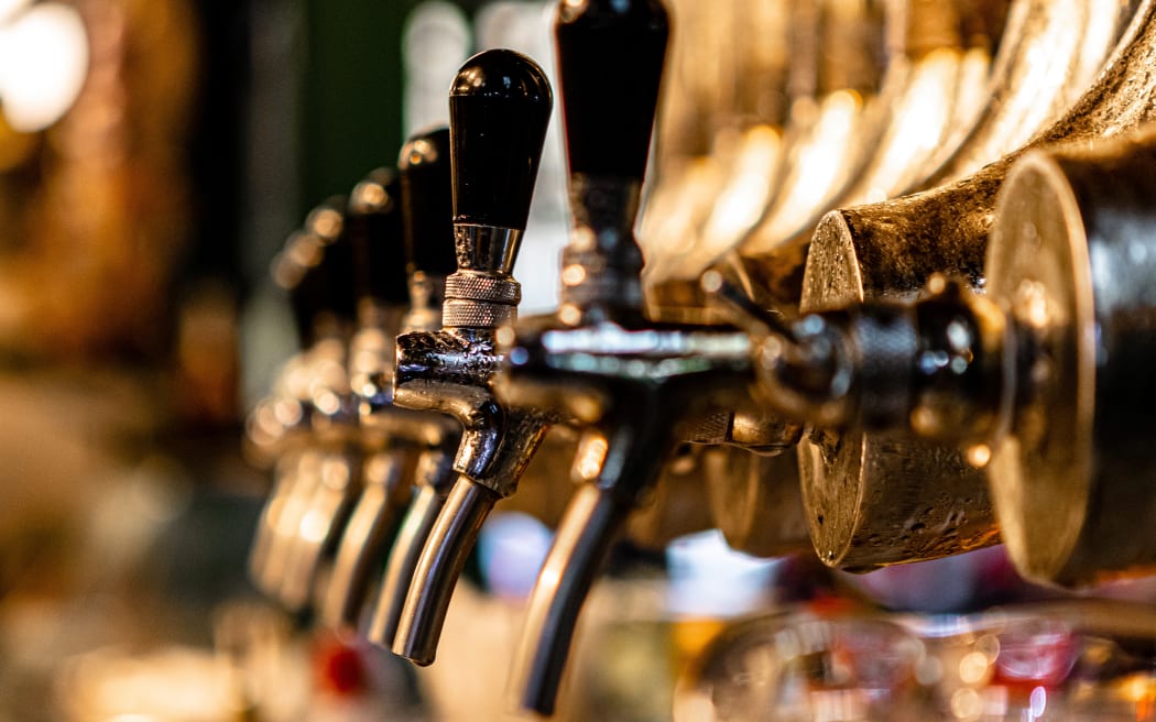 Beer taps in a bar.