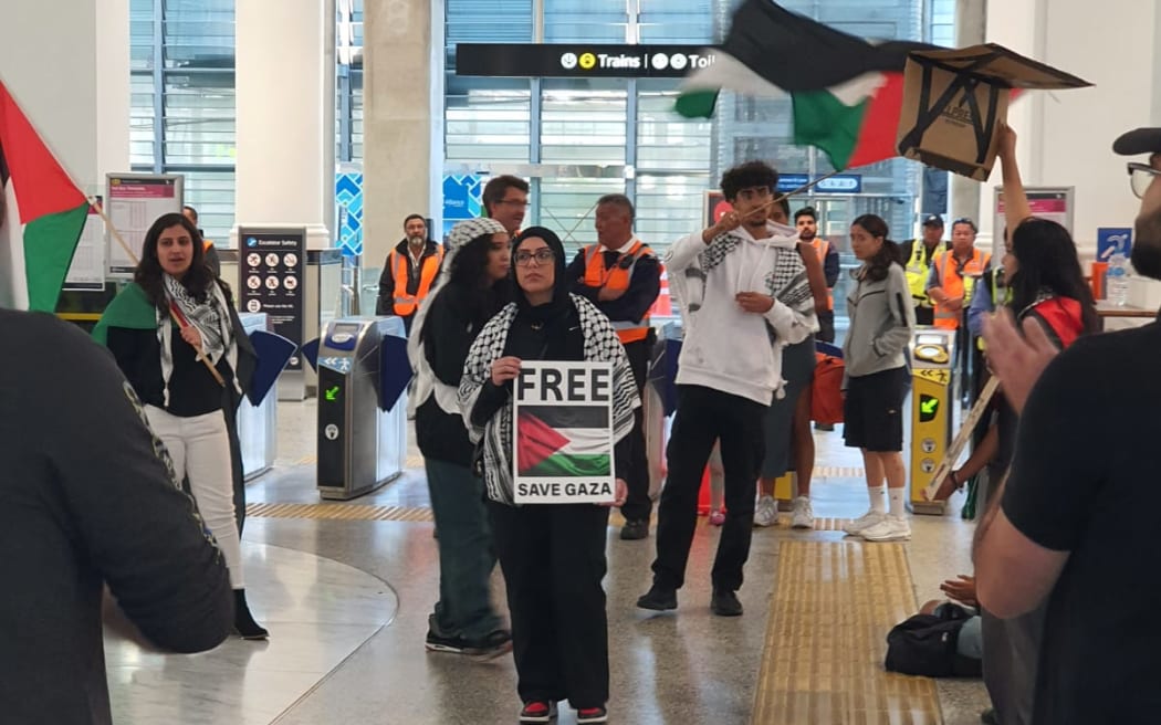 Pro-Palestine demonstrators at Britomart Train Station in Auckland on 10 November 2023.