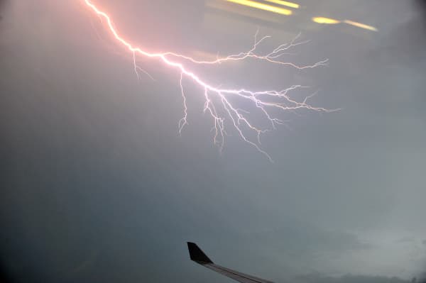 Lightning is seen through the window of the Malaysian Airlines plane over the Kuala Lumpur city on November 29, 2010.