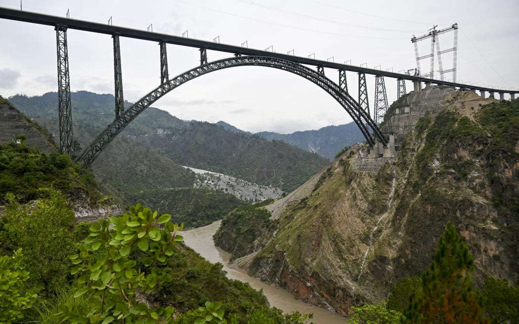 A general view of Chenab bridge, the world's highest rail arch bridge in Reasi, Jammu and Kashmir on July 6, 2024. (Photo by Tauseef MUSTAFA / AFP)