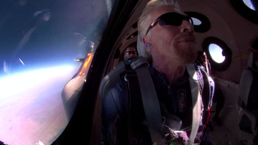 Billionaire Sir Richard Branson has successfully reached the edge of space on board his Virgin Galactic rocket plane.