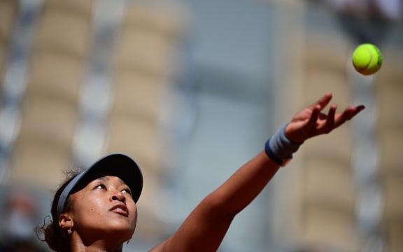 File photo: Japan's Naomi Osaka eyes the ball as she serves to Romania's Patricia Maria Tig during their women's singles first round tennis match on Day 1 of the French Open tennis tournament