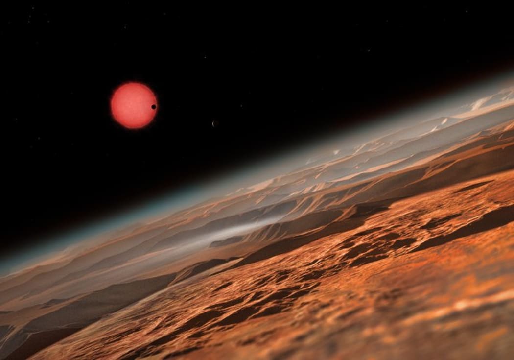 An artist’s impression showing the possible view from the surface one of the three planets orbiting an ultracool dwarf star just 40 light-years from Earth.