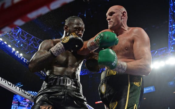 Deontay Wilder and Tyson Fury box during their WBC heavyweight title bout at MGM Grand Garden Arena. 2020.