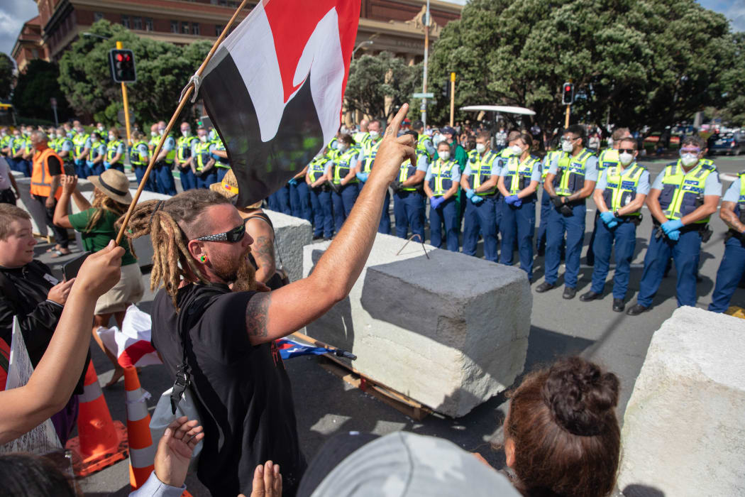 Protestors and Police standoff as police move concrete barricades